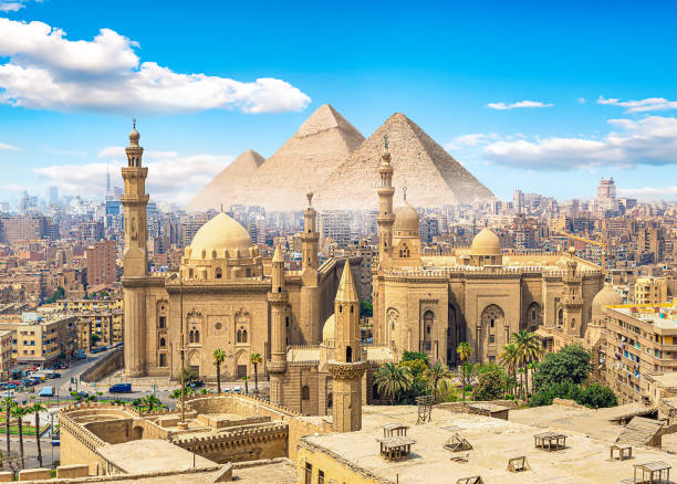 Mosque Sultan Hassan in Cairo and pyramids